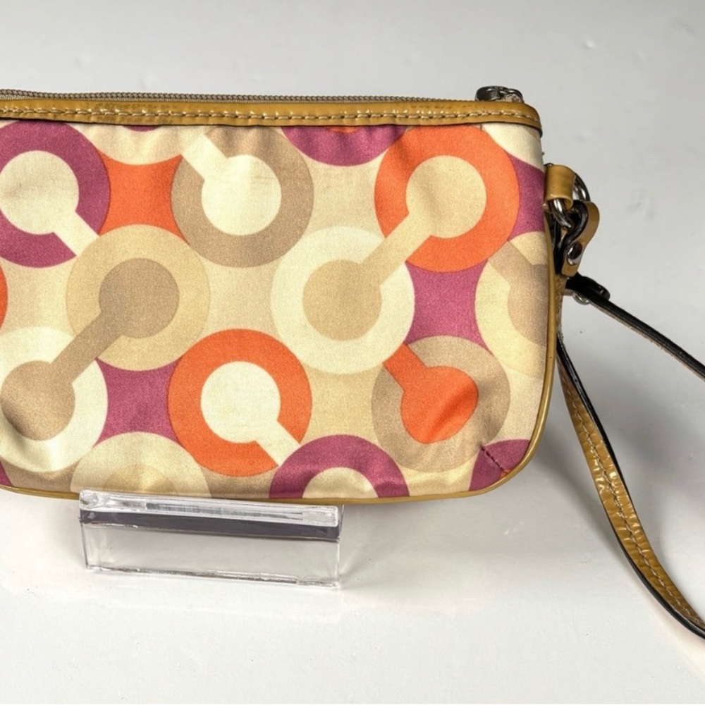 Coach Optic C Colorful Patterned Wristlet
Orange pink cream. Patent Leather - Picture 3 of 11